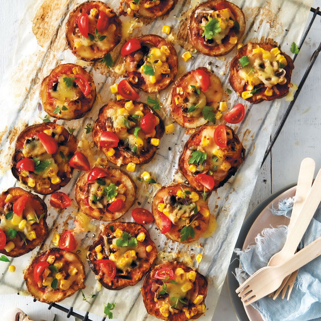 Healthy mini pizzas cooling on a wire rack.