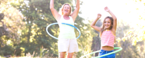 Woman and child hula hooping