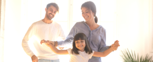 Family dancing around living room