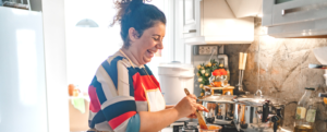 Lady cooking in kitchen