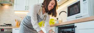 Woman loading dishwasher