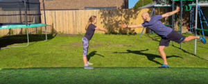 Parent and child active in backyard